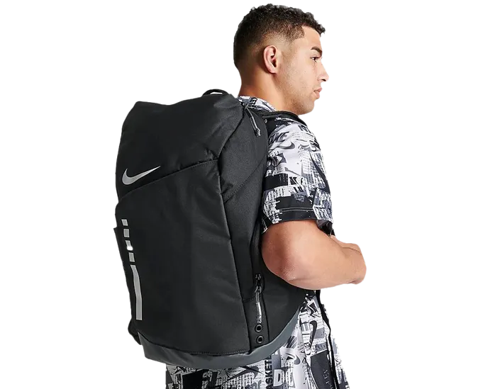 Man carrying black Nike backpack with modern design showcasing [Nike bags in BD] for travel, gym, or everyday use.