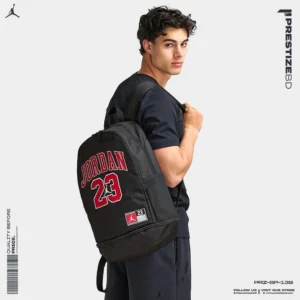 Stylish young man wearing a black outfit carrying a Jordan 23 backpack — men bag price in Bangladesh] affordable fashion gear.